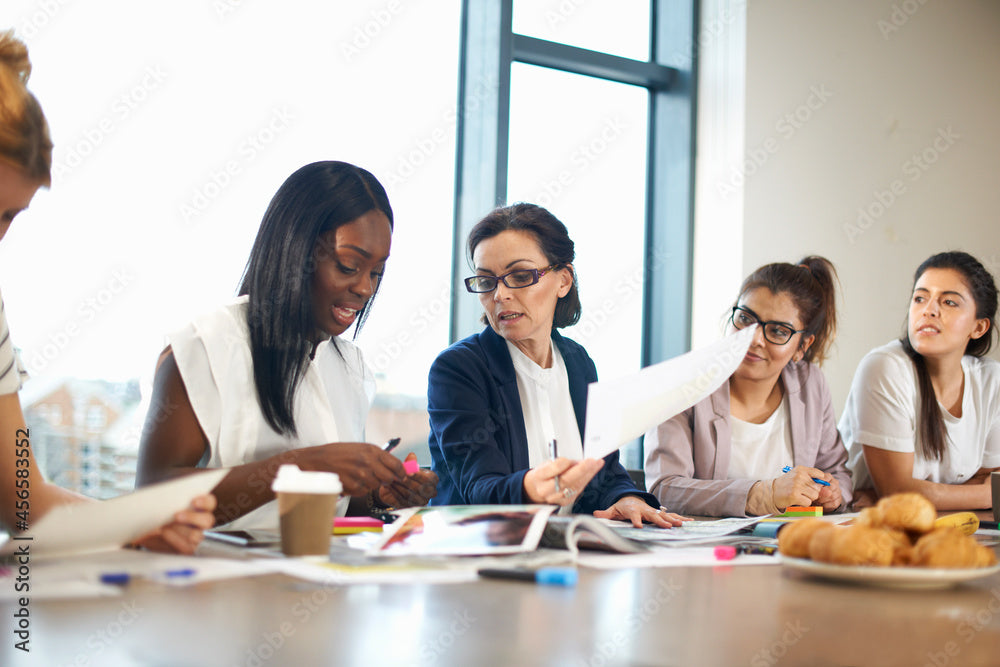 Women having meeting at conference room table